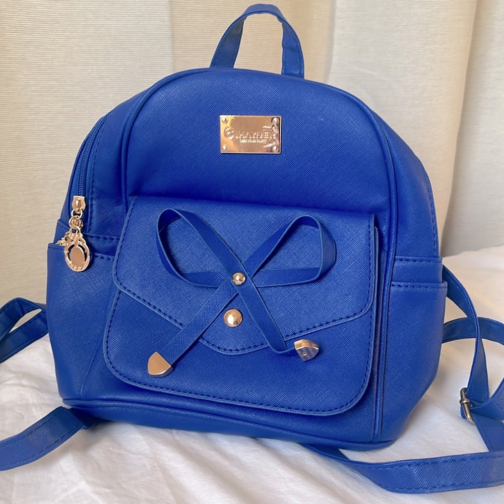Blue bow mini backpack with gold accents